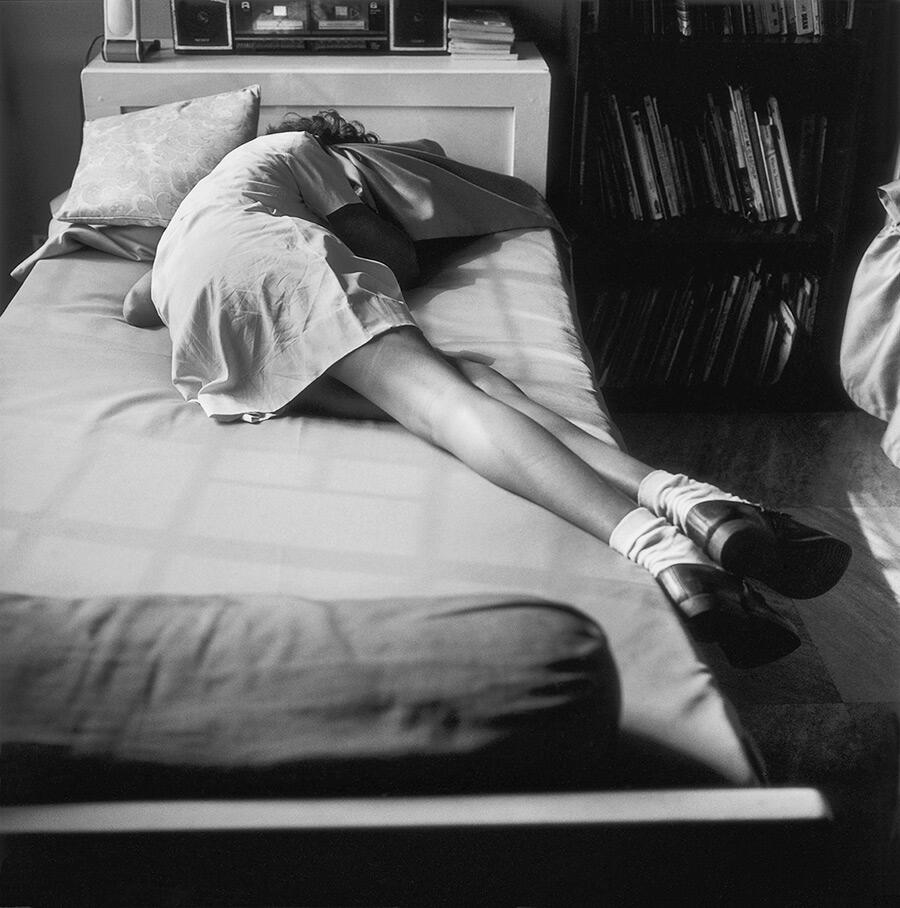 Dayanita-singh-photograph-girl-laying-on-bed